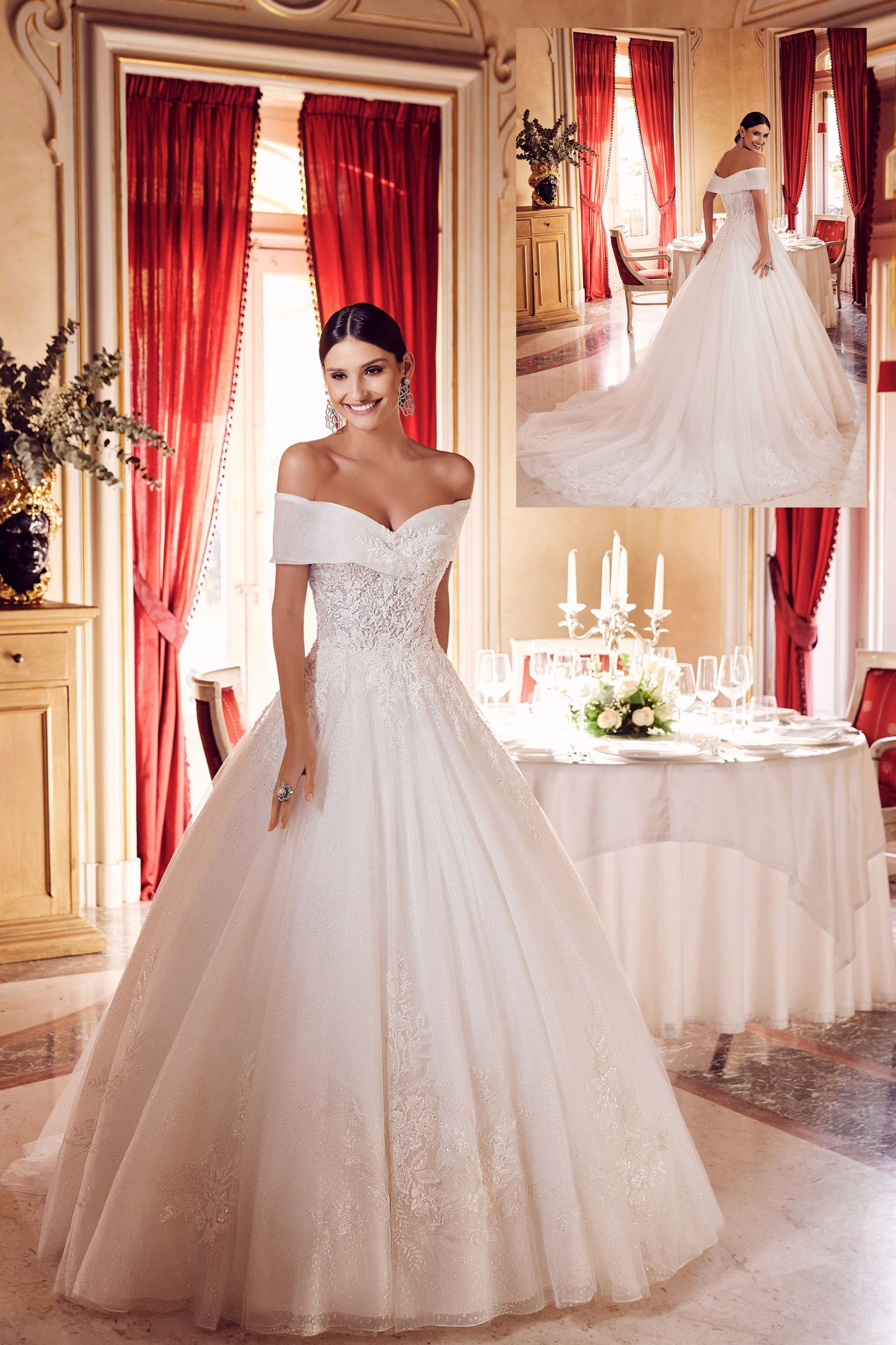 Una donna in abito da sposa bianco è in piedi davanti a un tavolo.