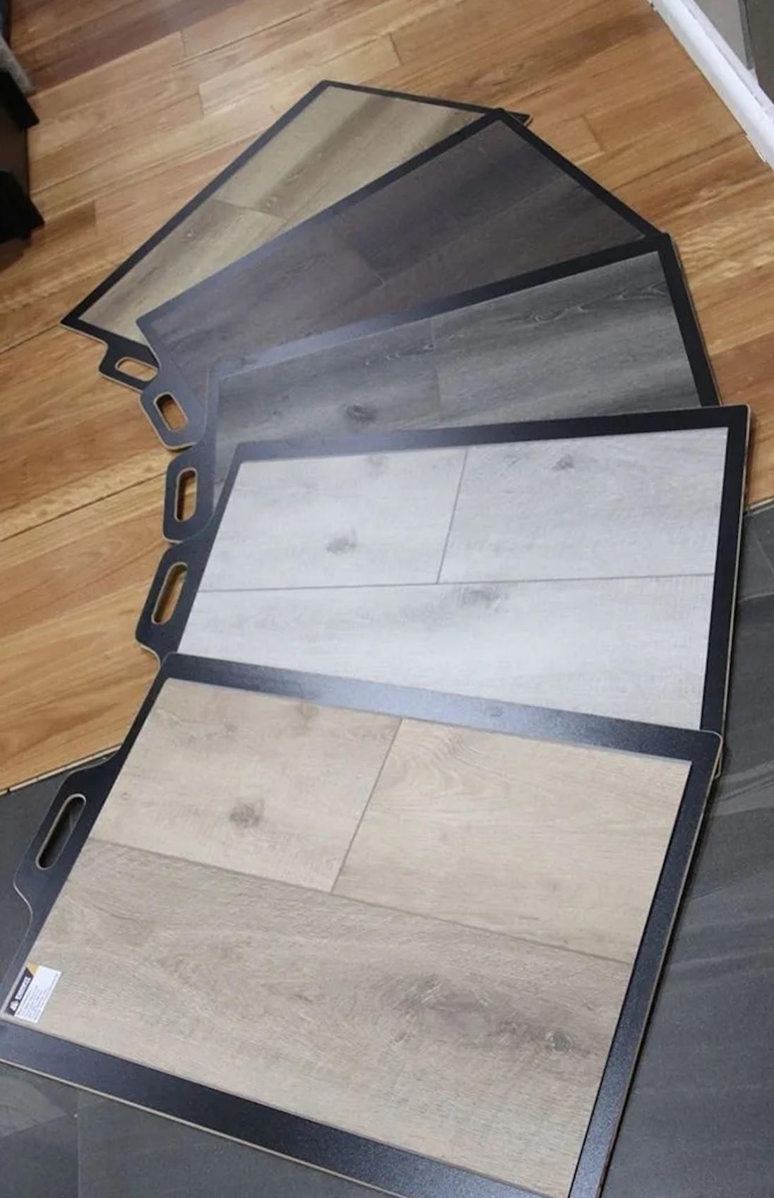 A Display of Different Types of Tiles on a Wooden Floor — Traditional Tiles & Flooring in Palm Cove, QLD