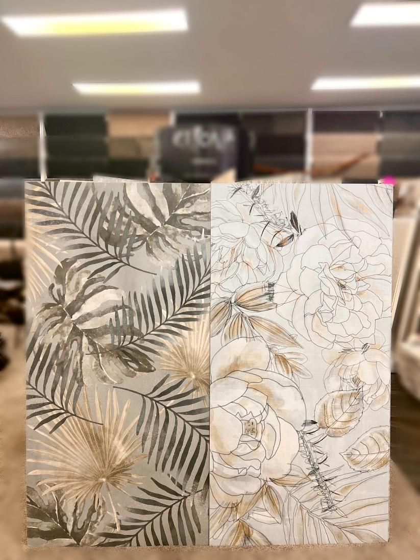 Two Tiles With Leaves on Them Are Sitting Next to Each Other in a Store — Traditional Tiles & Flooring in Palm Cove, QLD