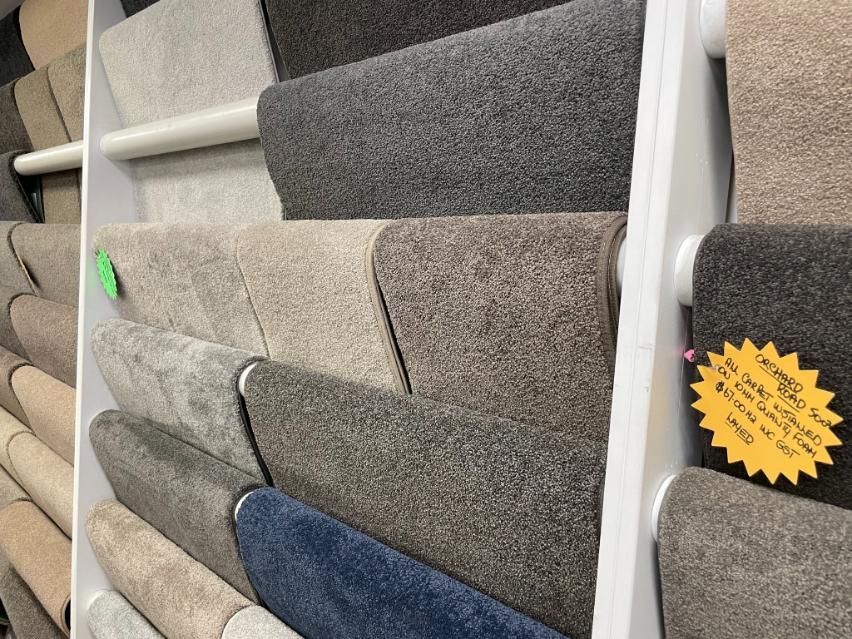 A Display of Different Colored Carpets in a Store — Traditional Tiles & Flooring in Palm Cove, QLD