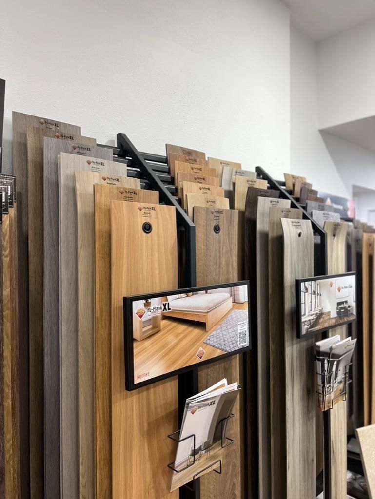 A Display of Wooden Boards and a Mirror in a Store — Traditional Tiles & Flooring In Woree, QLD