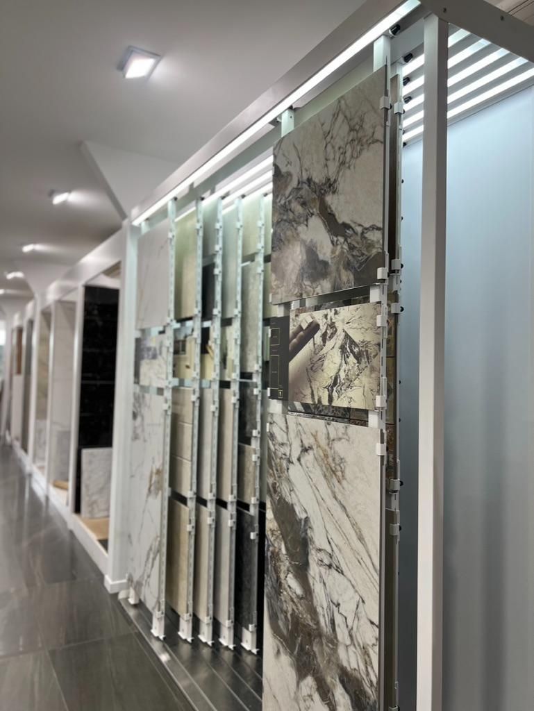 A Row of Tiles Are Hanging on a Wall in a Store — Traditional Tiles & Flooring In Woree, QLD