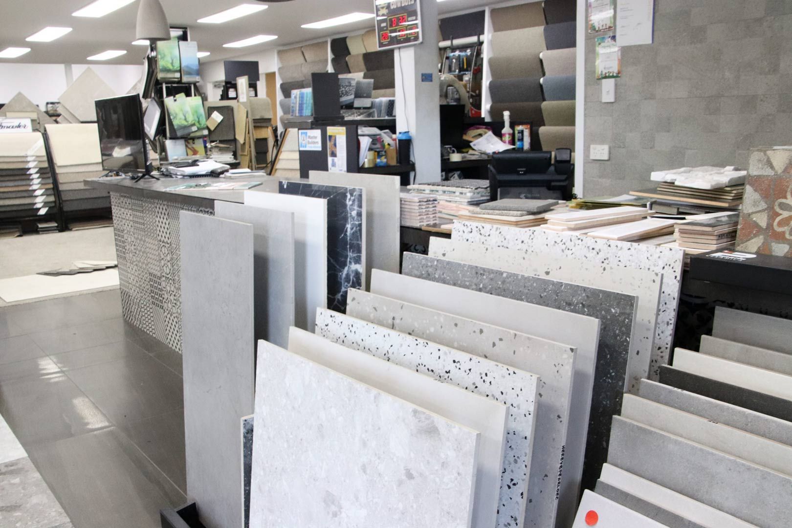 A Store Filled with Lots of Tiles and A Counter — Traditional Tiles & Flooring In Woree, QLD