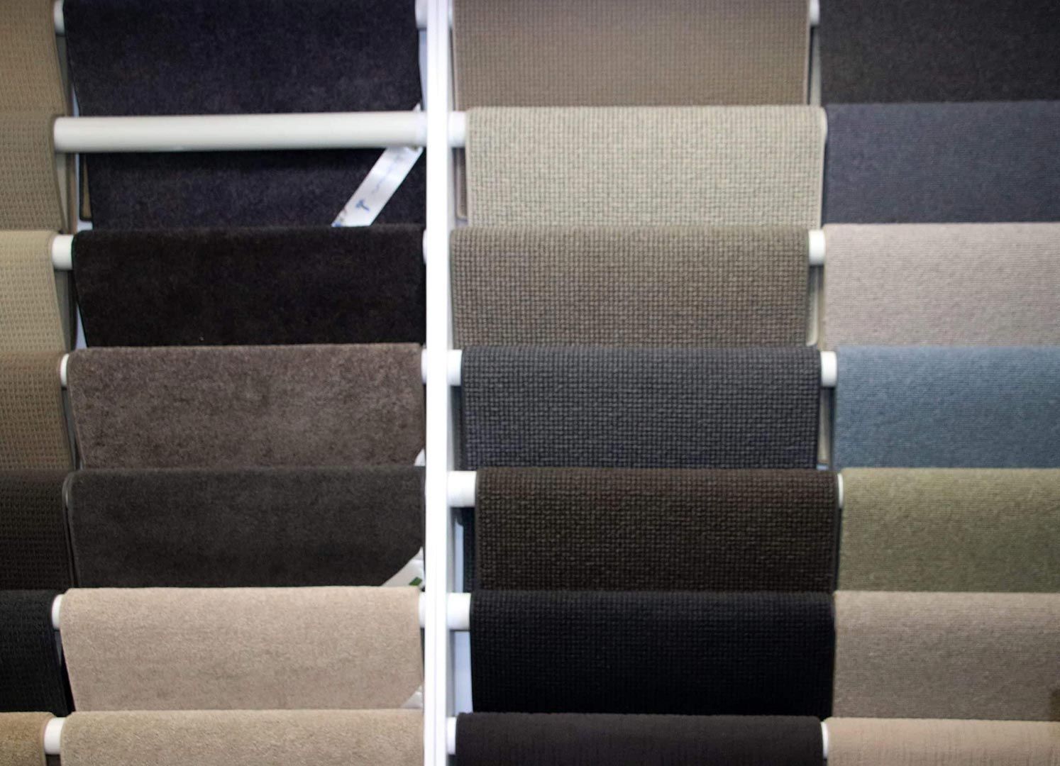 A Display of Different Colored Carpets in A Store — Traditional Tiles & Flooring In Woree, QLD