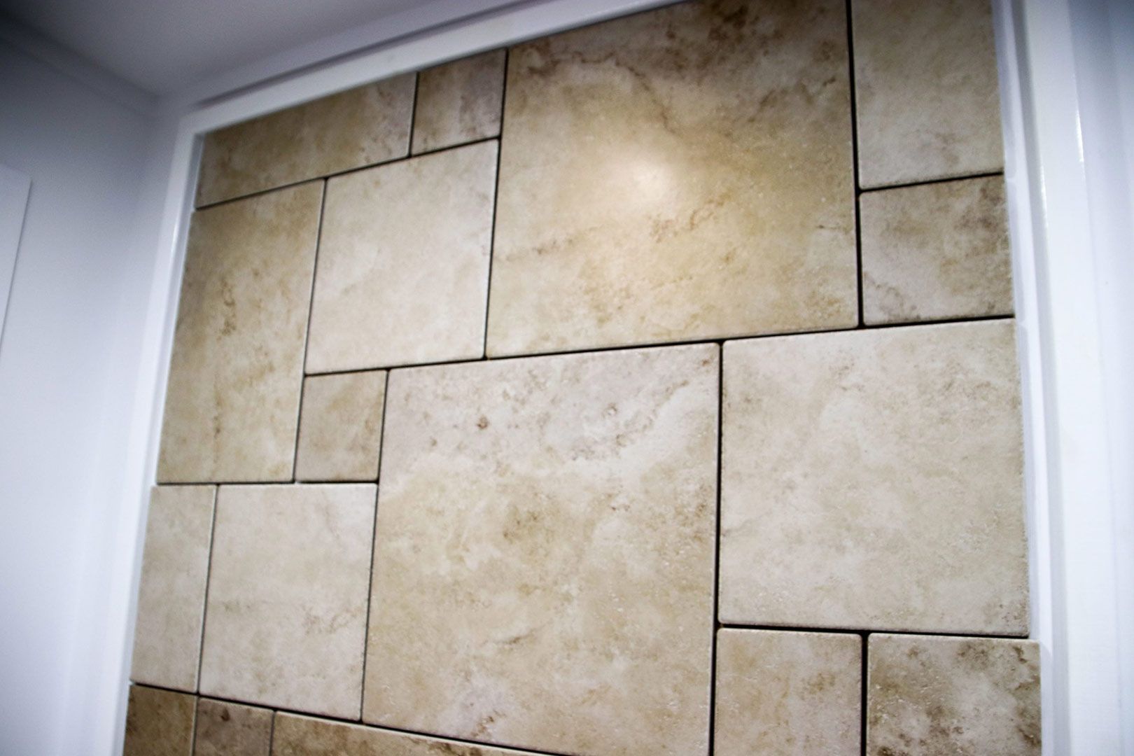 A Wall with A Lot of Tiles on It — Traditional Tiles & Flooring In Woree, QLD