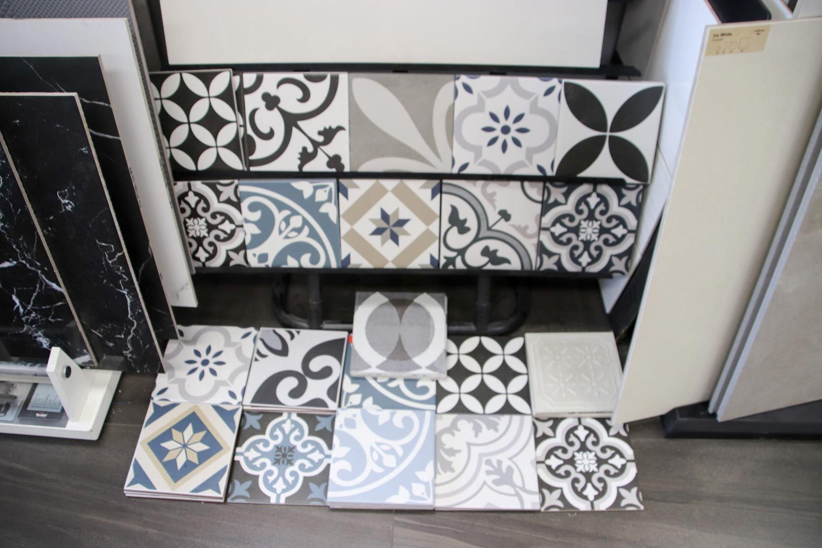 A Bunch of Tiles Are Sitting on The Floor in Front of A Dresser — Traditional Tiles & Flooring In Woree, QLD