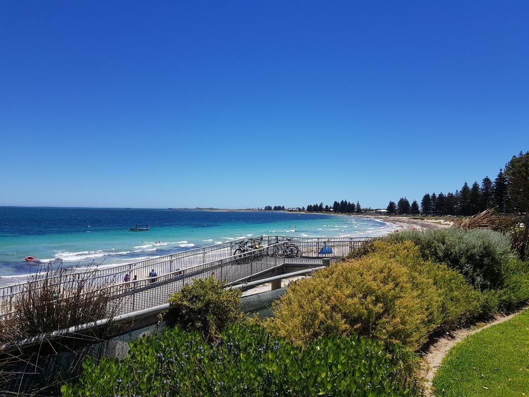 A View of a Beach From a Park on a Sunny Day — Traditional Tiles & Flooring in Bentley Park, QLD