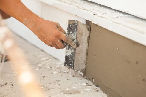 stucco repair under window sill