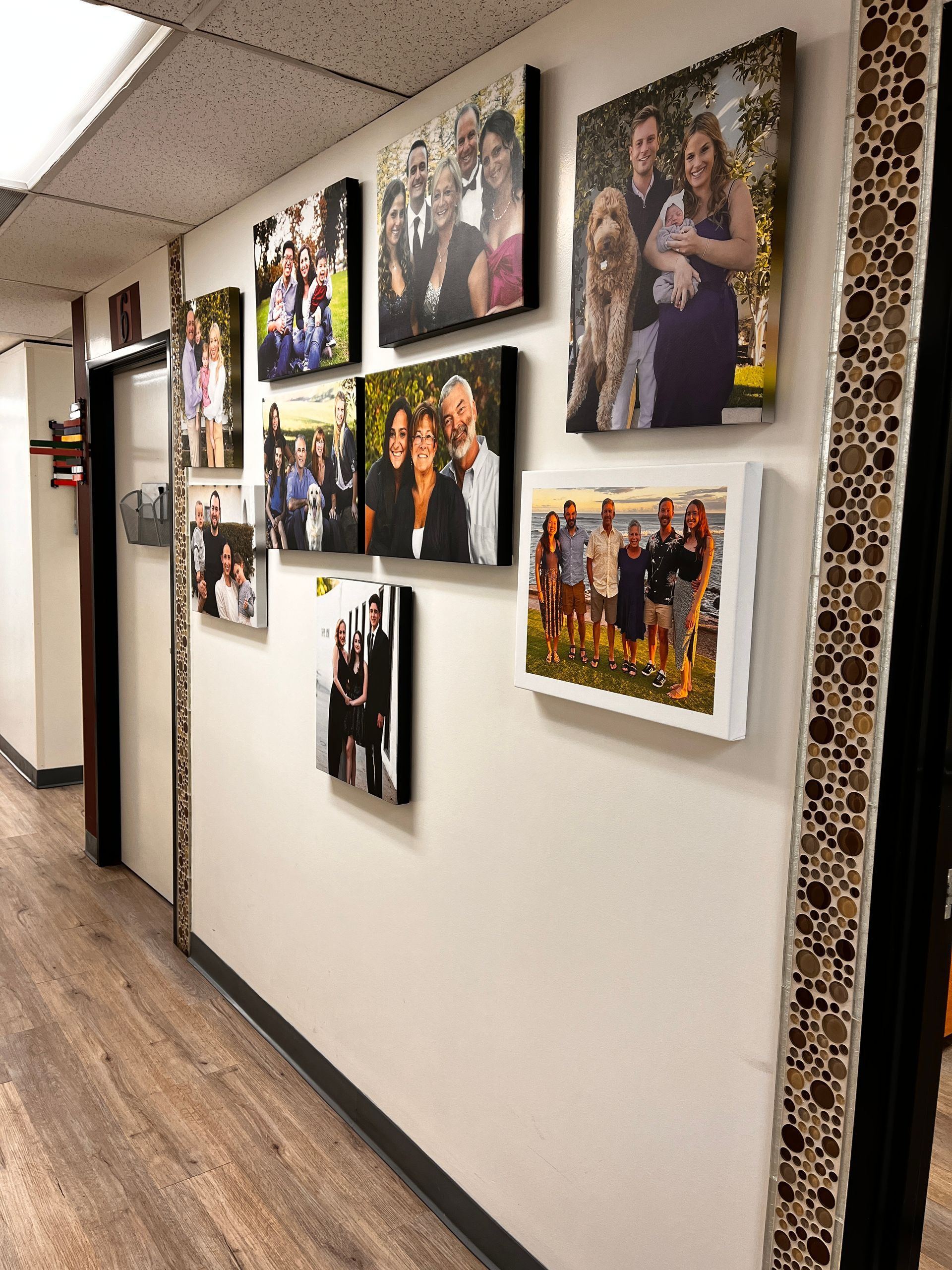 A hallway with a lot of pictures on the wall.