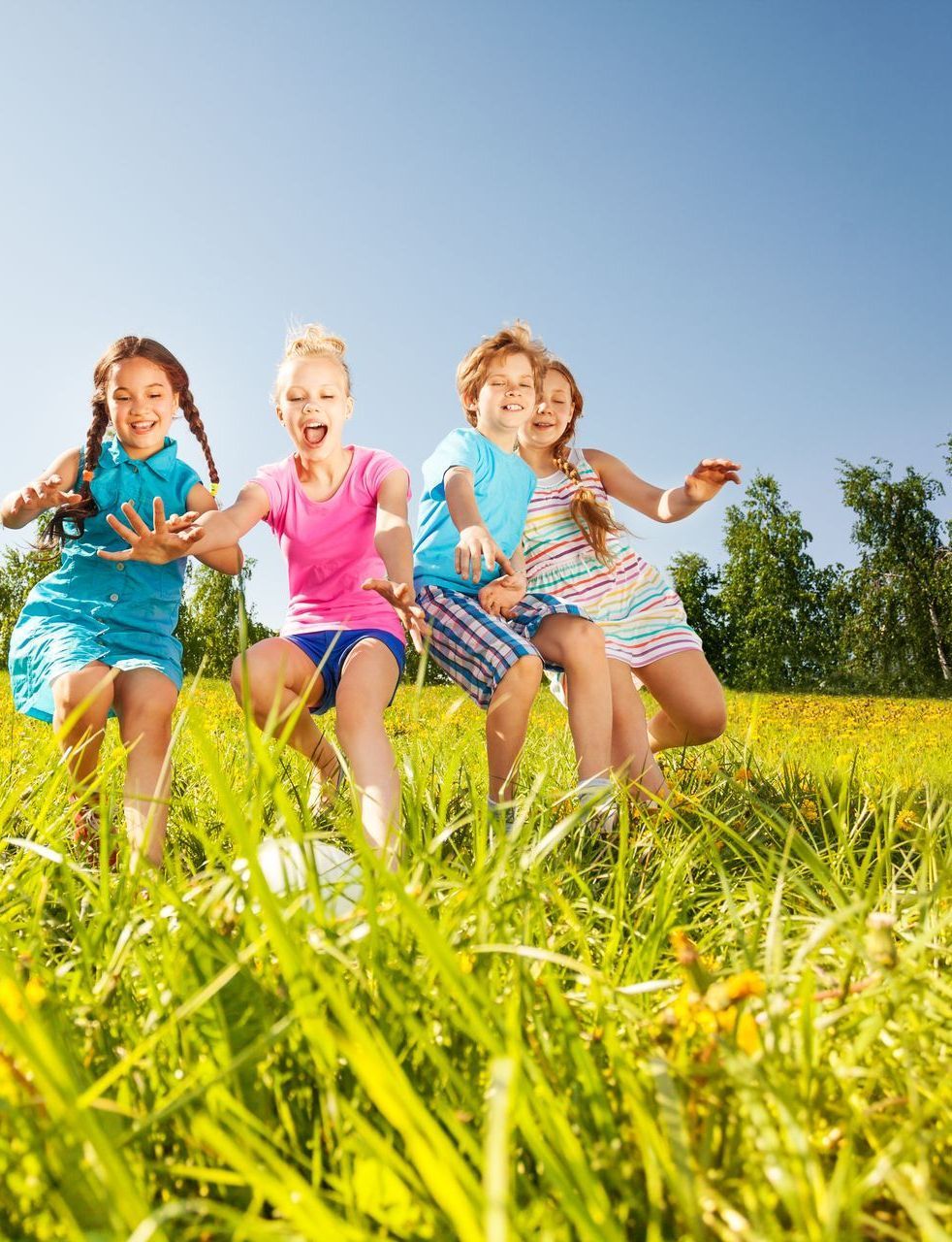 Children playing in a field. Children playing in a field.