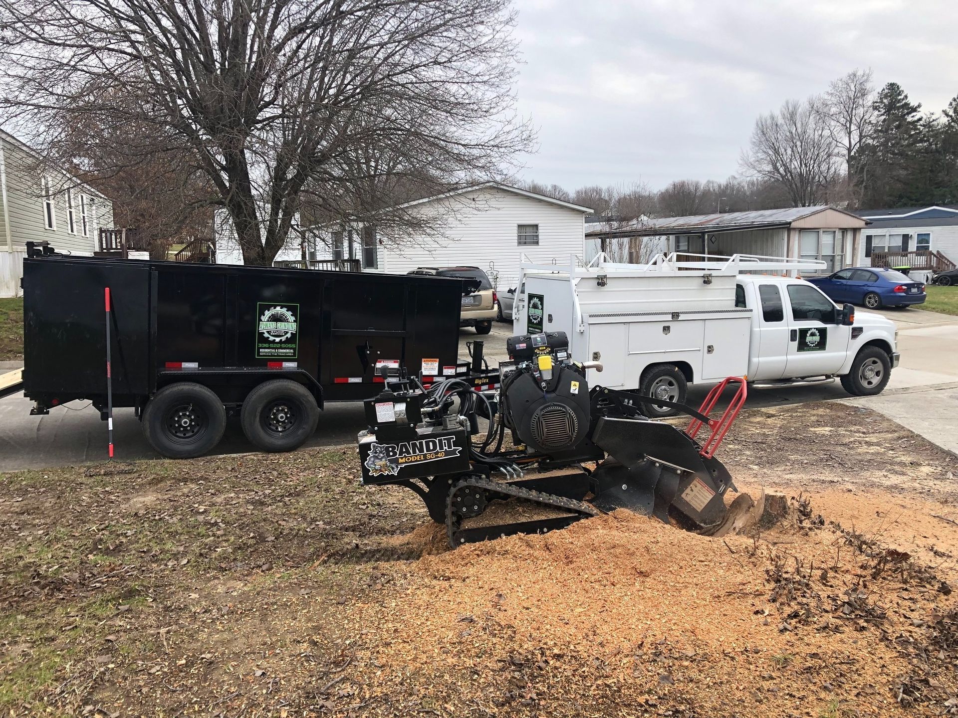 A stump grinder is being used to remove a tree stump.
