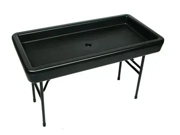 a black plastic table with metal legs on a white background