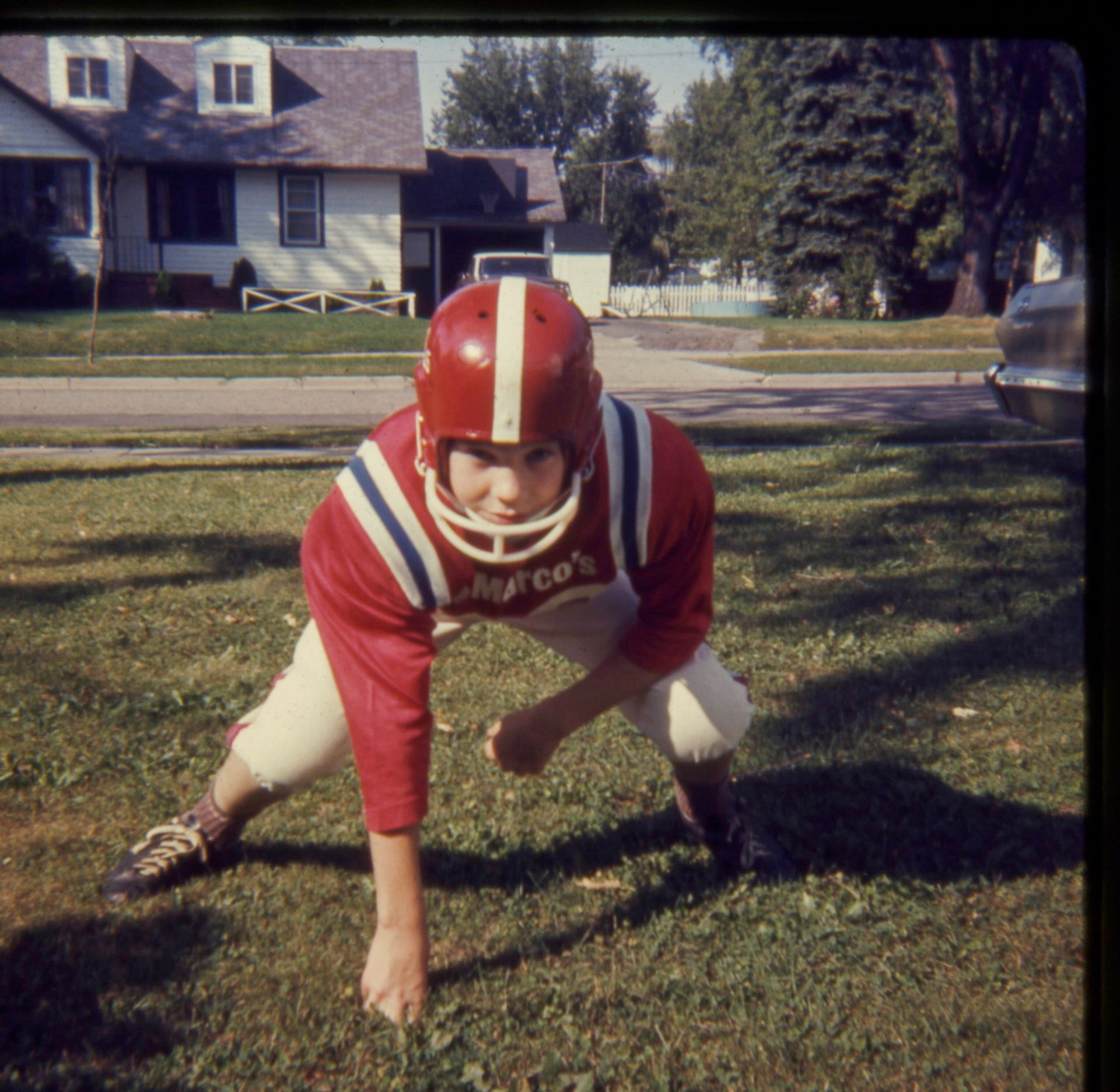 A young boy wearing a red jersey that says ' chicago ' on it