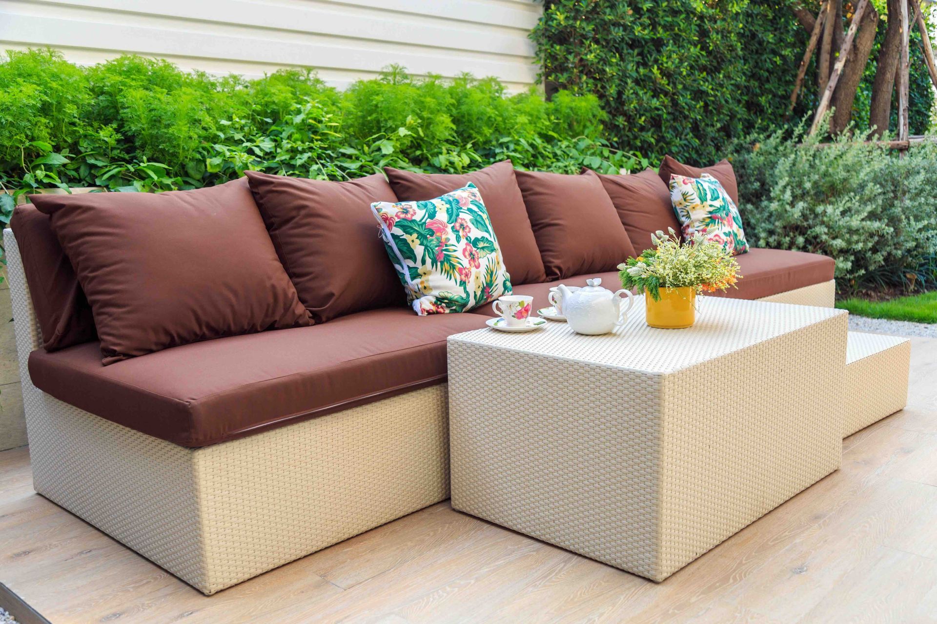 A patio with a couch and a coffee table.