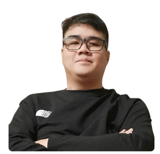 Marius Carlos Jr. in a black sweatshirt with is arms crossed.