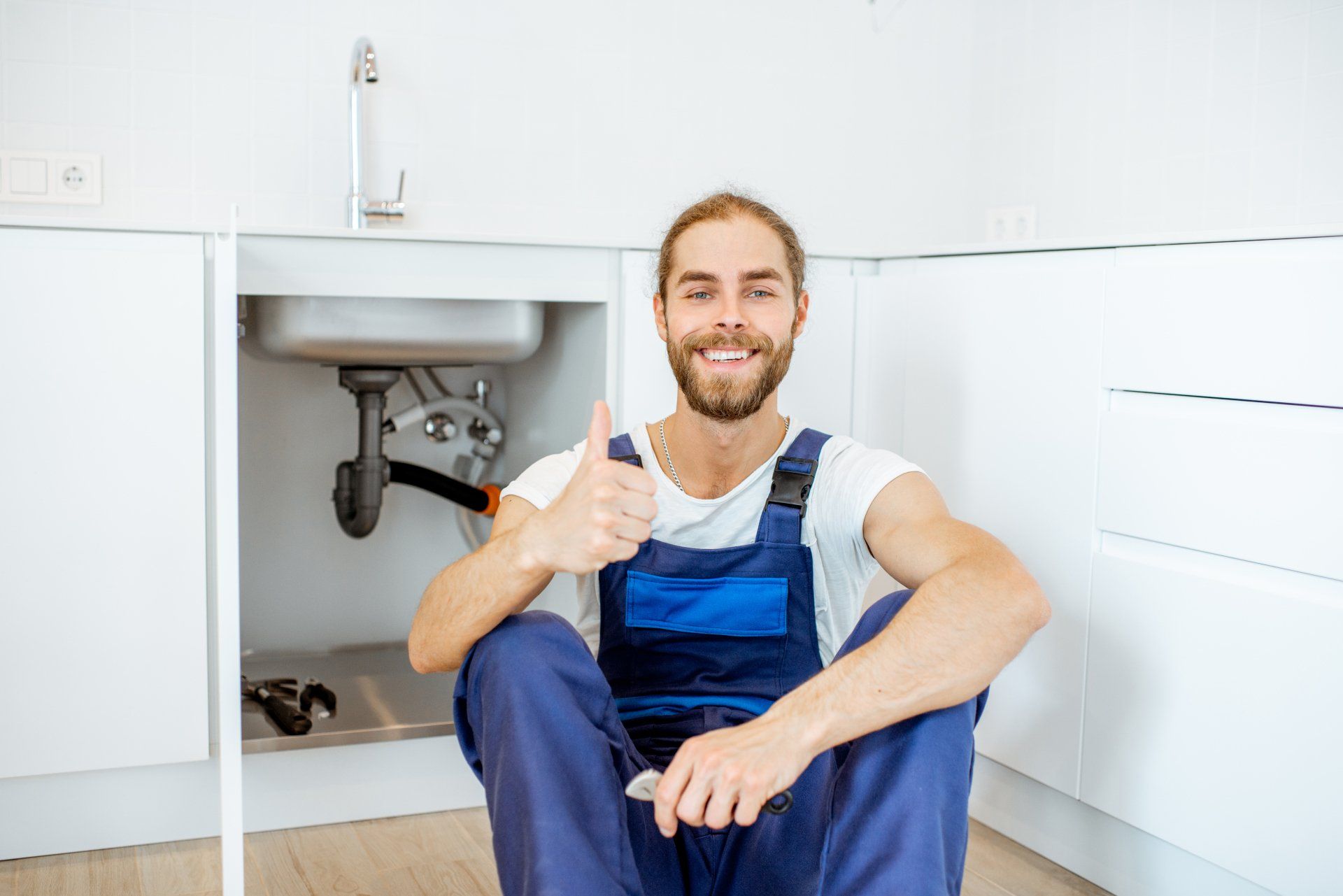 Plumber with thumbs up
