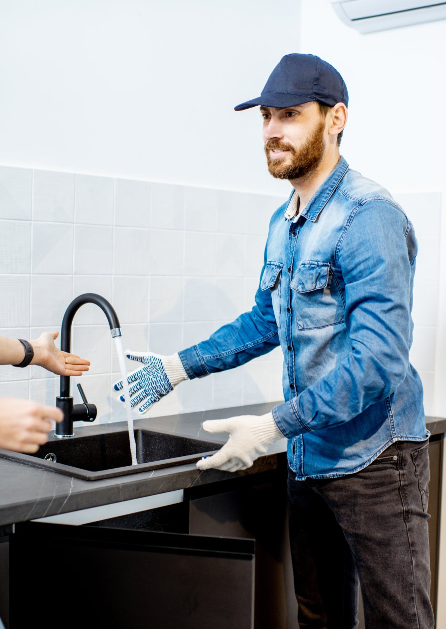 plumber by running faucet