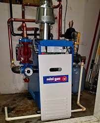 an engineer servicing boiler