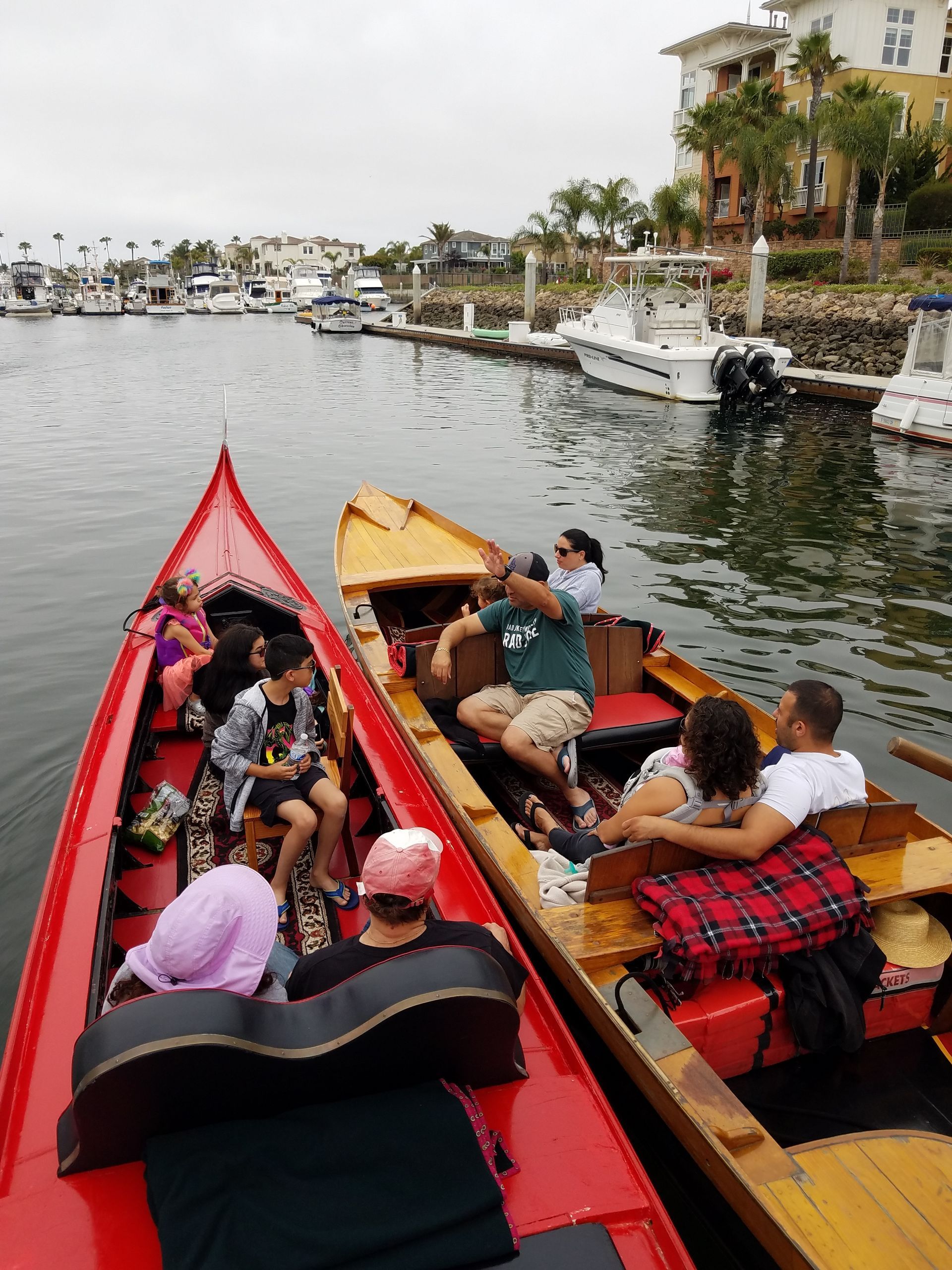 A group of people are in a boat on a river