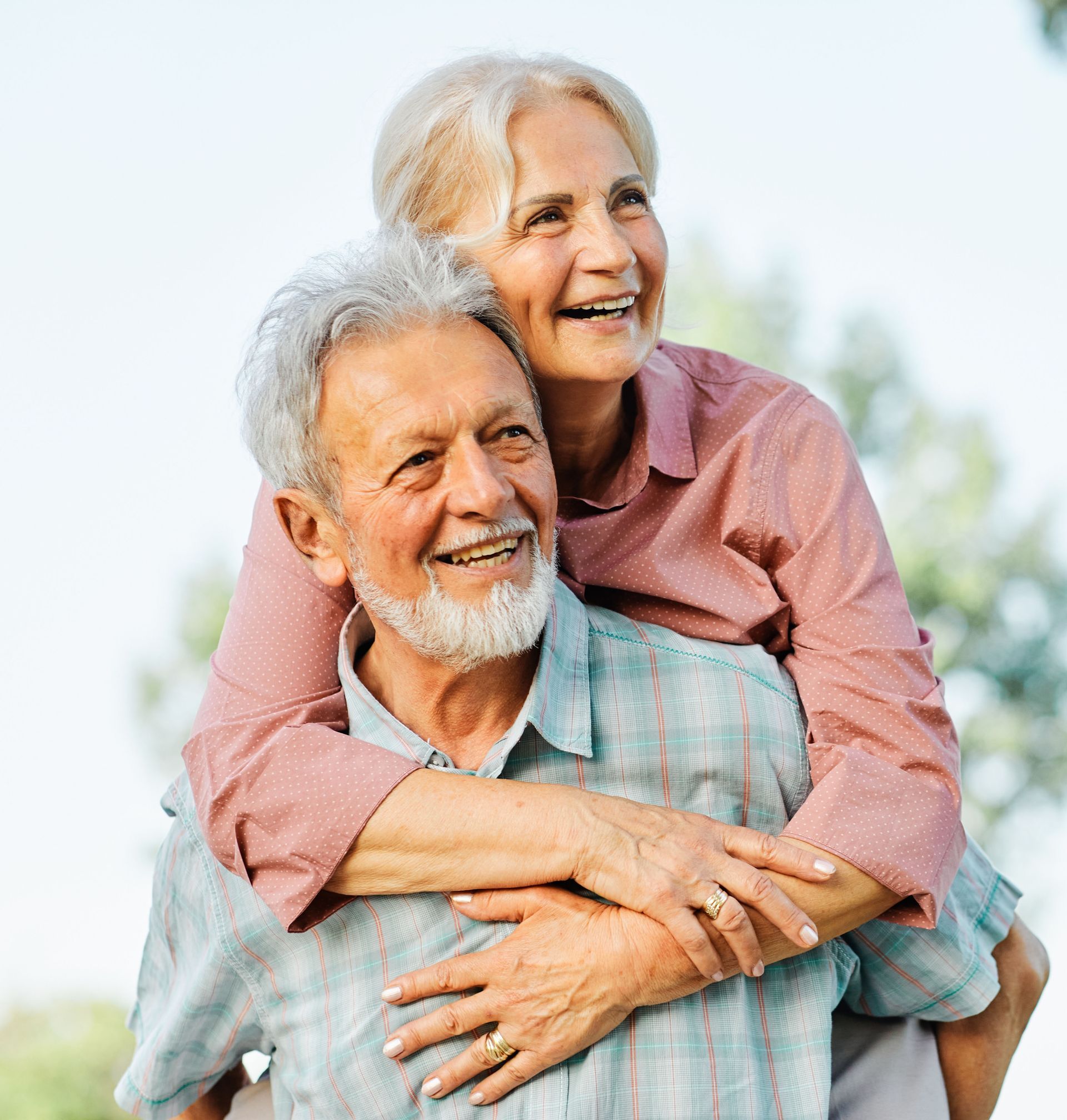A man is carrying a woman on his back.