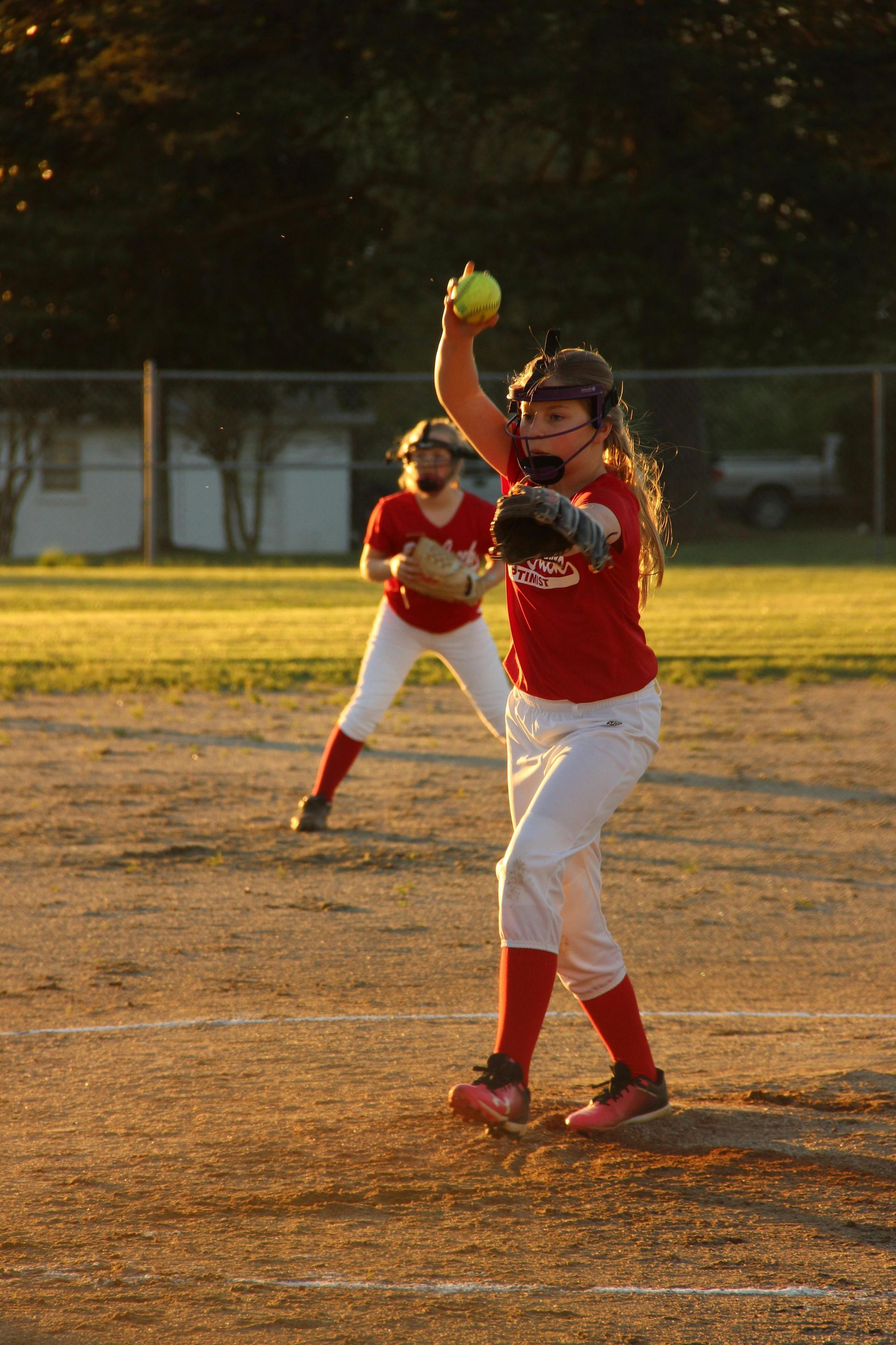 Baseball on a dark surface, with visible stitching.