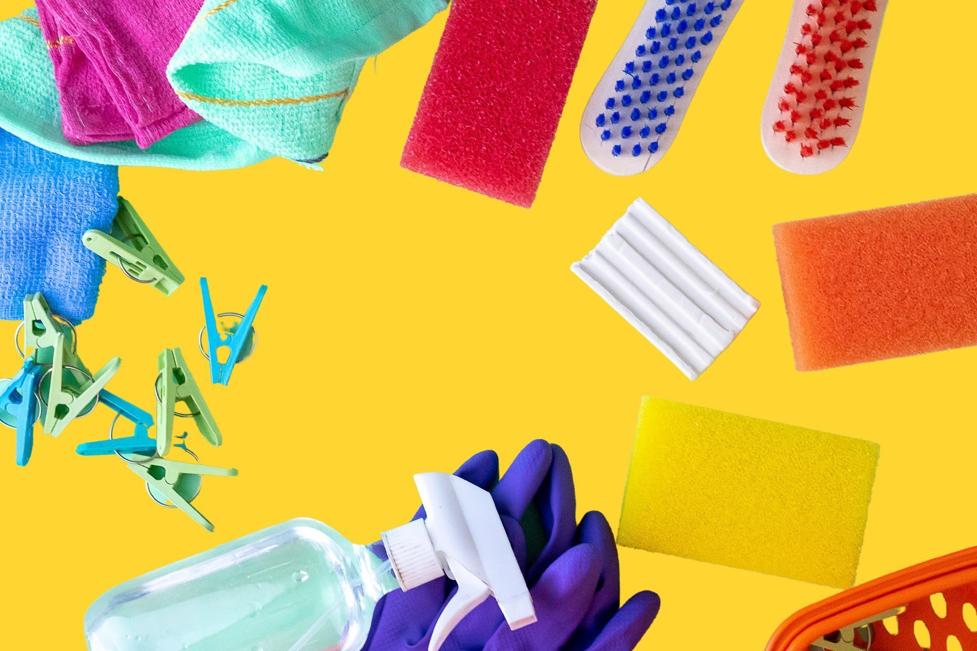 Image of cleaning essentials on a yellow background