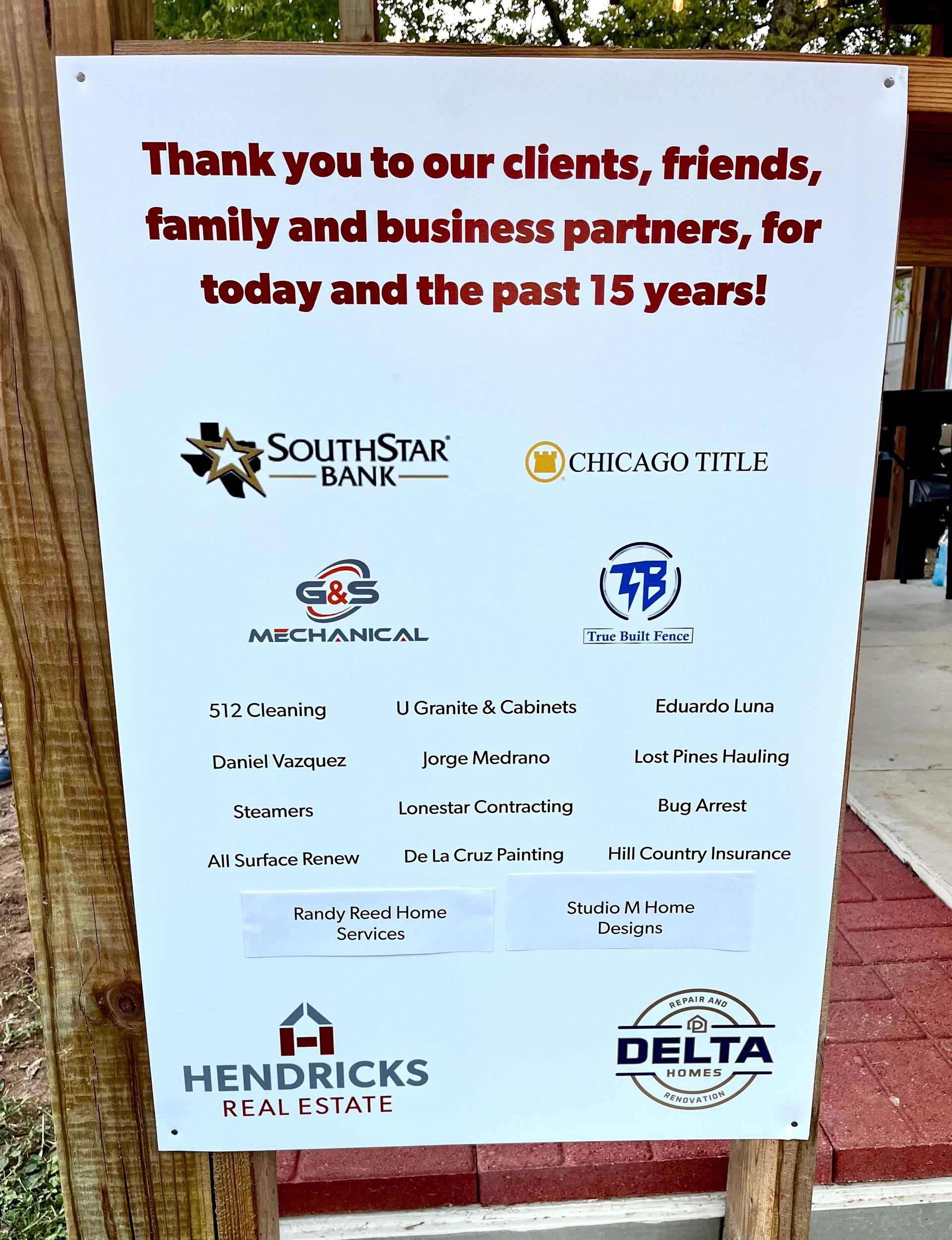 Sign thanking clients and partners for 15 years, with company logos including Southstar Bank and Chicago Title.