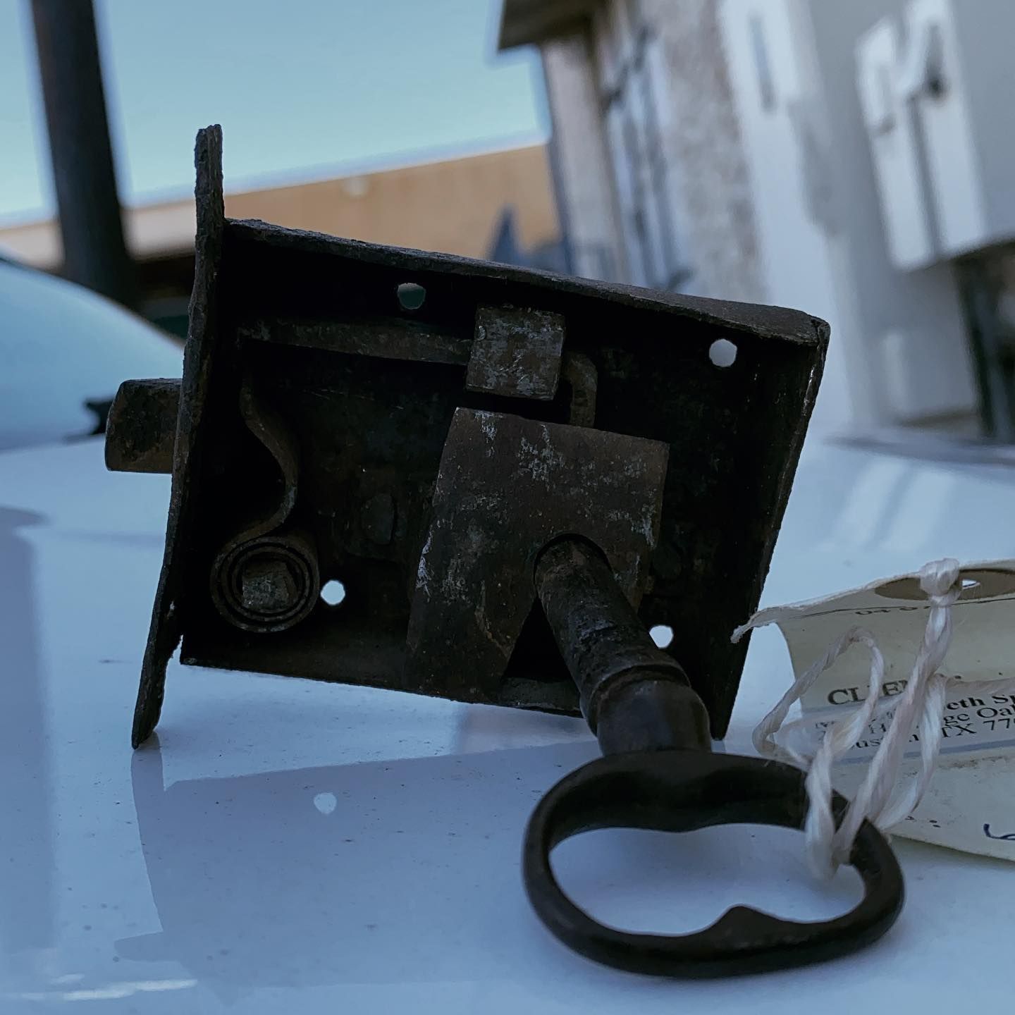 Knapp lock and Safe: A removed door knob part with an old key attached, showcasing the expertise of locksmith services in repairing and replacing door hardware.