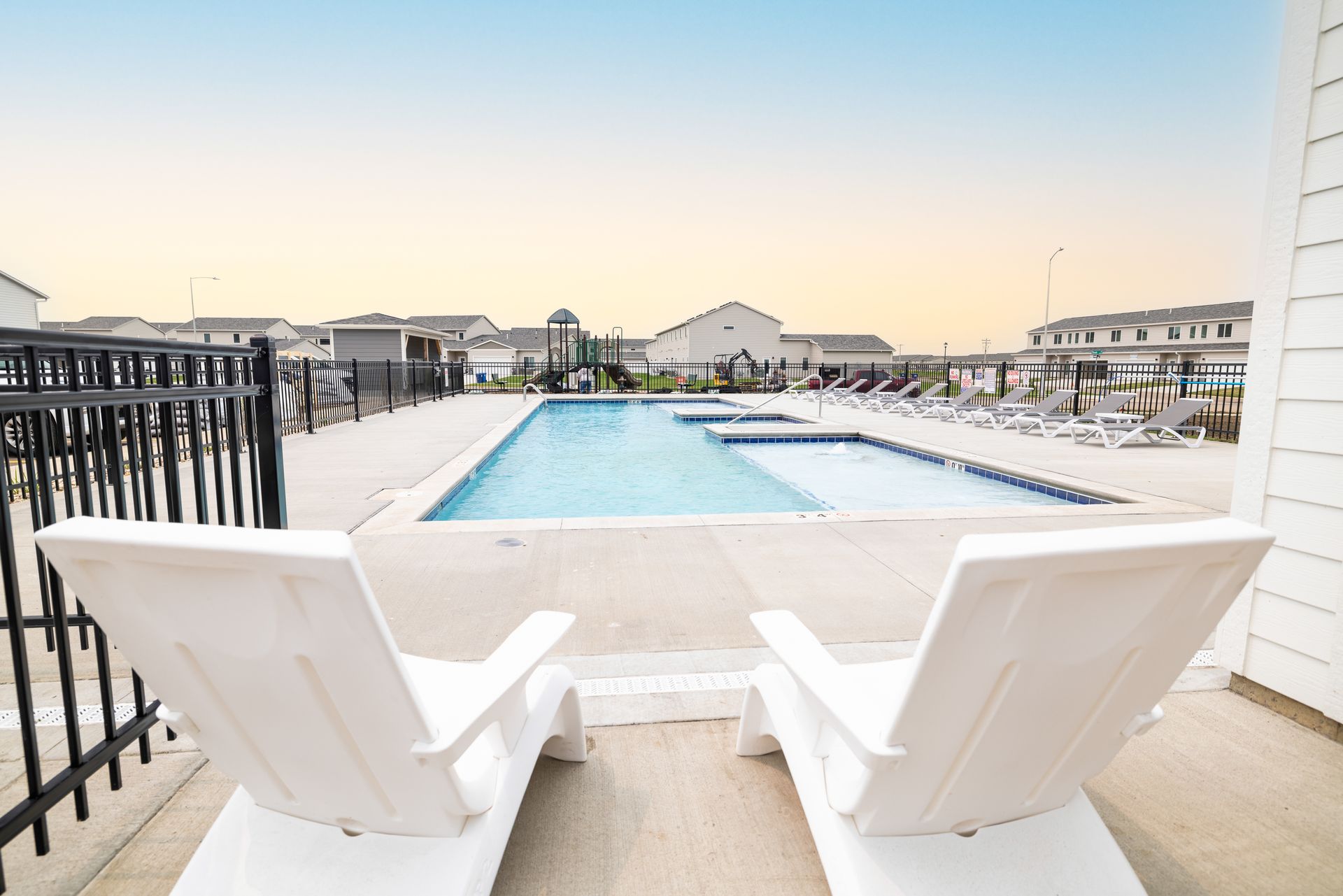 Pool chairs in front of pool