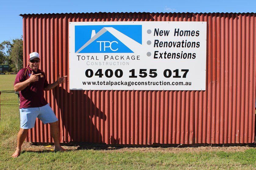 Australian Man Pointing Out Local Advertising | Total Package Construction