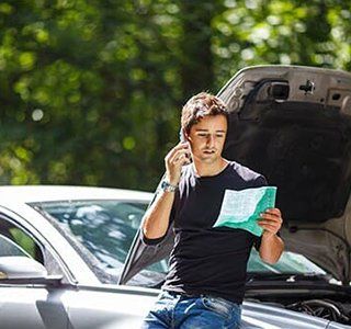 High Risk Auto Insurance — Man Talking to Phone in Johnson City, TN