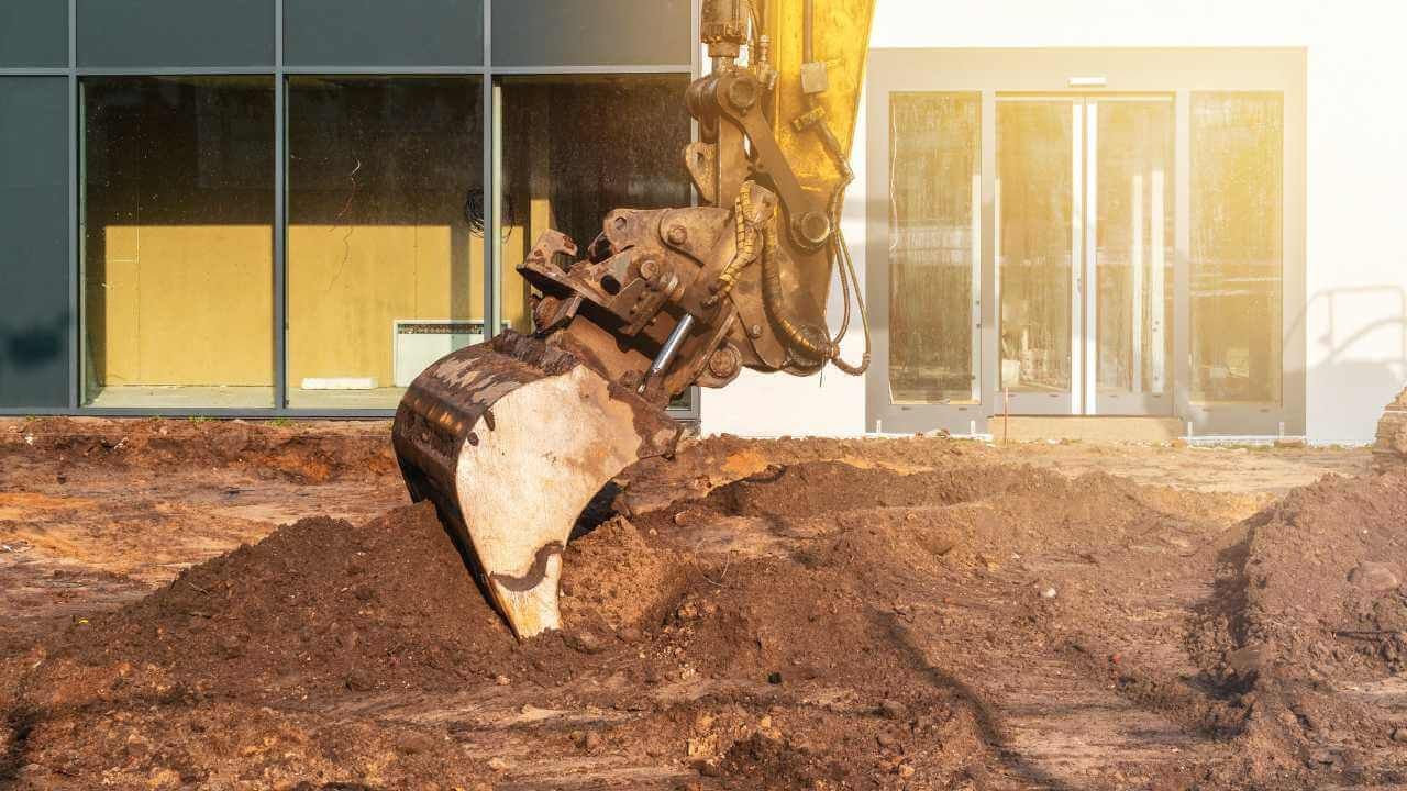 A bulldozer is digging a hole