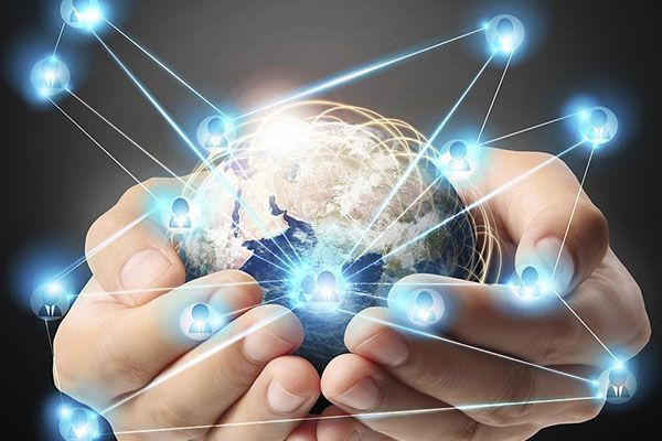 Hands cupped around a globe with glowing, interconnected nodes representing a global communications network.
