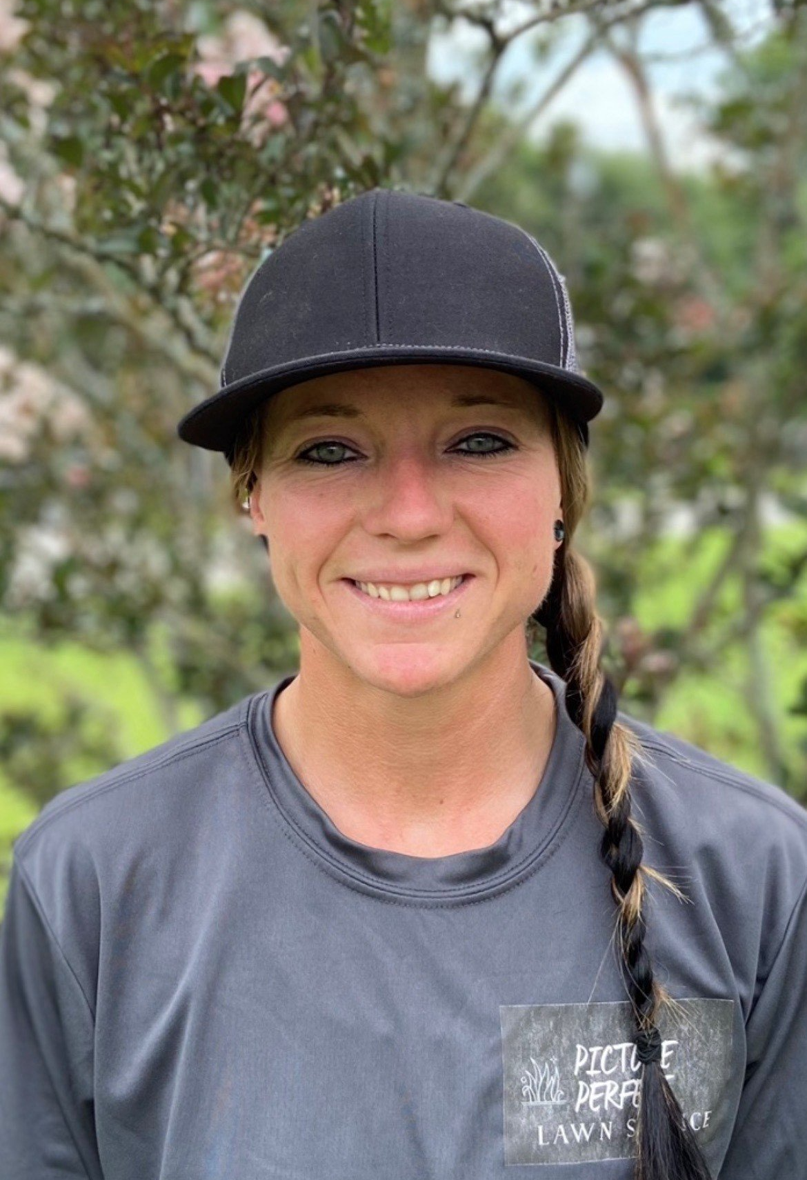 Woman Wearing A Cap — Fayetteville, NC — Picture Perfect Lawn Service LLC