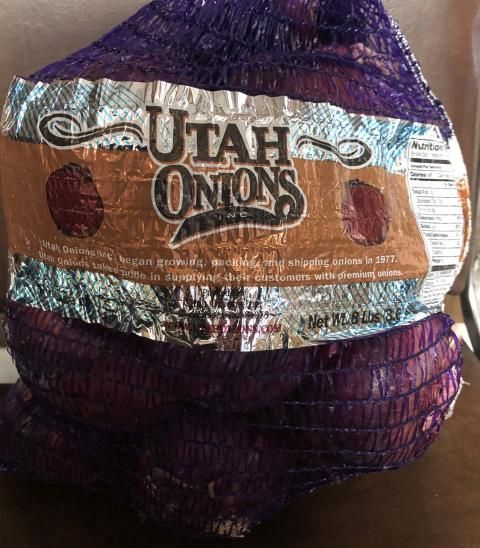 A bag of utah onions sits on a table