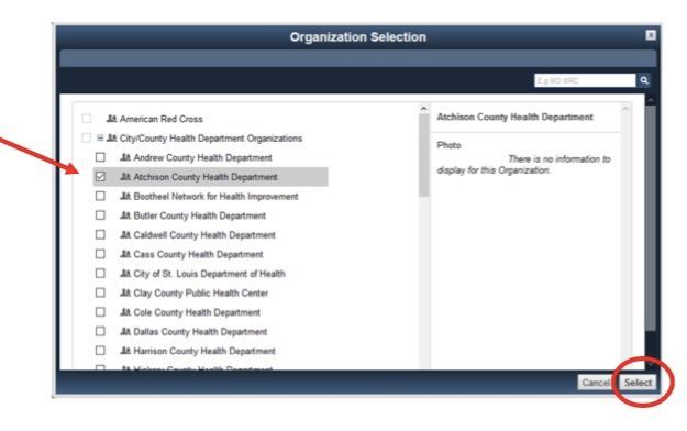 A computer screen shows the organization selection screen