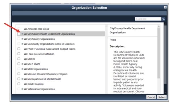 A computer screen shows the organization selection screen