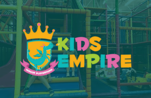 A colorful logo for a kids empire playground with a crown on it.