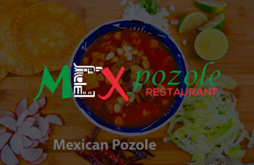 A bowl of mexican pozole is sitting on a wooden table.