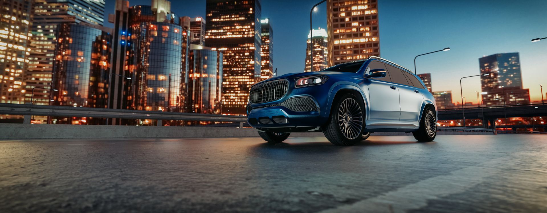 A blue SUV on a city road at dusk, with bright buildings in the background.