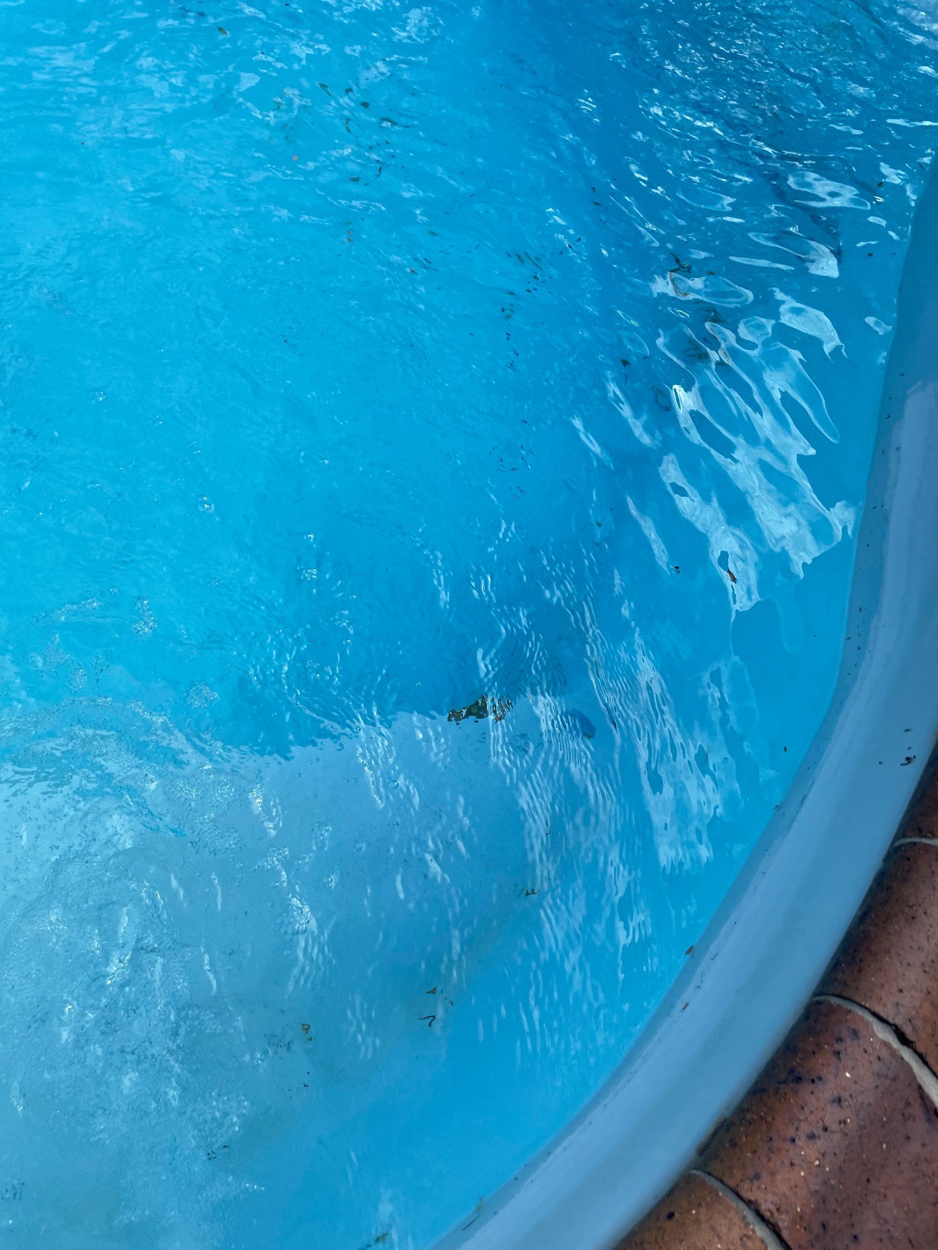 Blue Water in a Curved Pool With Light Reflections and a Glimpse of the Edge — Leak N Pool In Southport, QLD