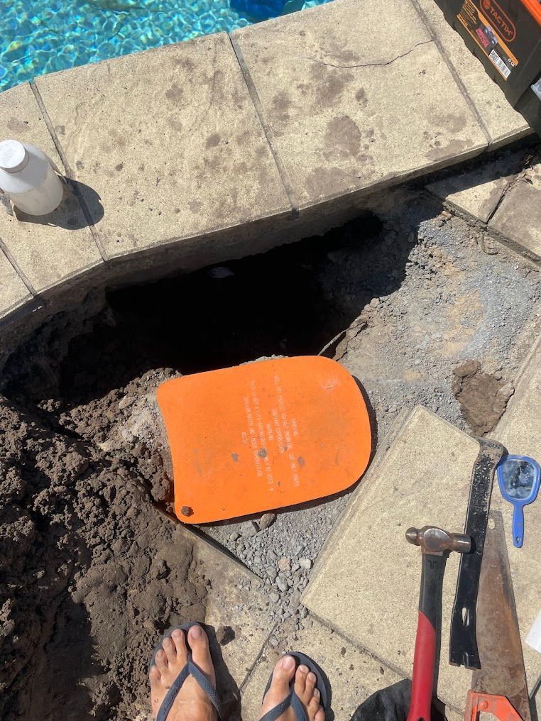 Pool Repair Site With Exposed Pipe, Tools, and Orange Trowel — Leak N Pool In Southport, QLD