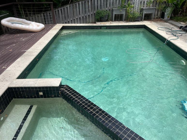 A Rectangular Swimming Pool Filled With Clear Water — Leak N Pool In Southport, QLD