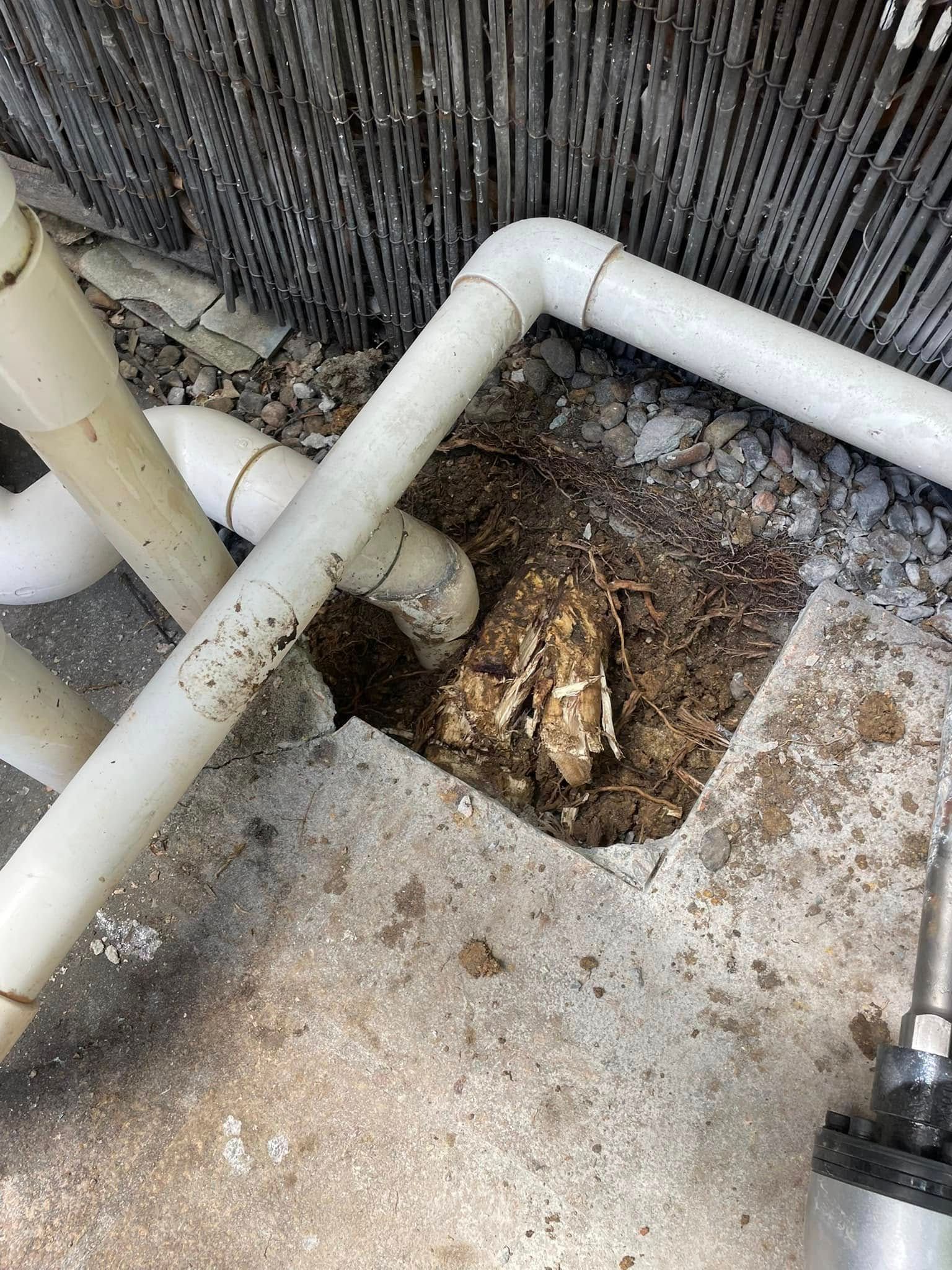 Hole in Concrete Near White Pipes and Debris — Leak N Pool In Southport, QLD