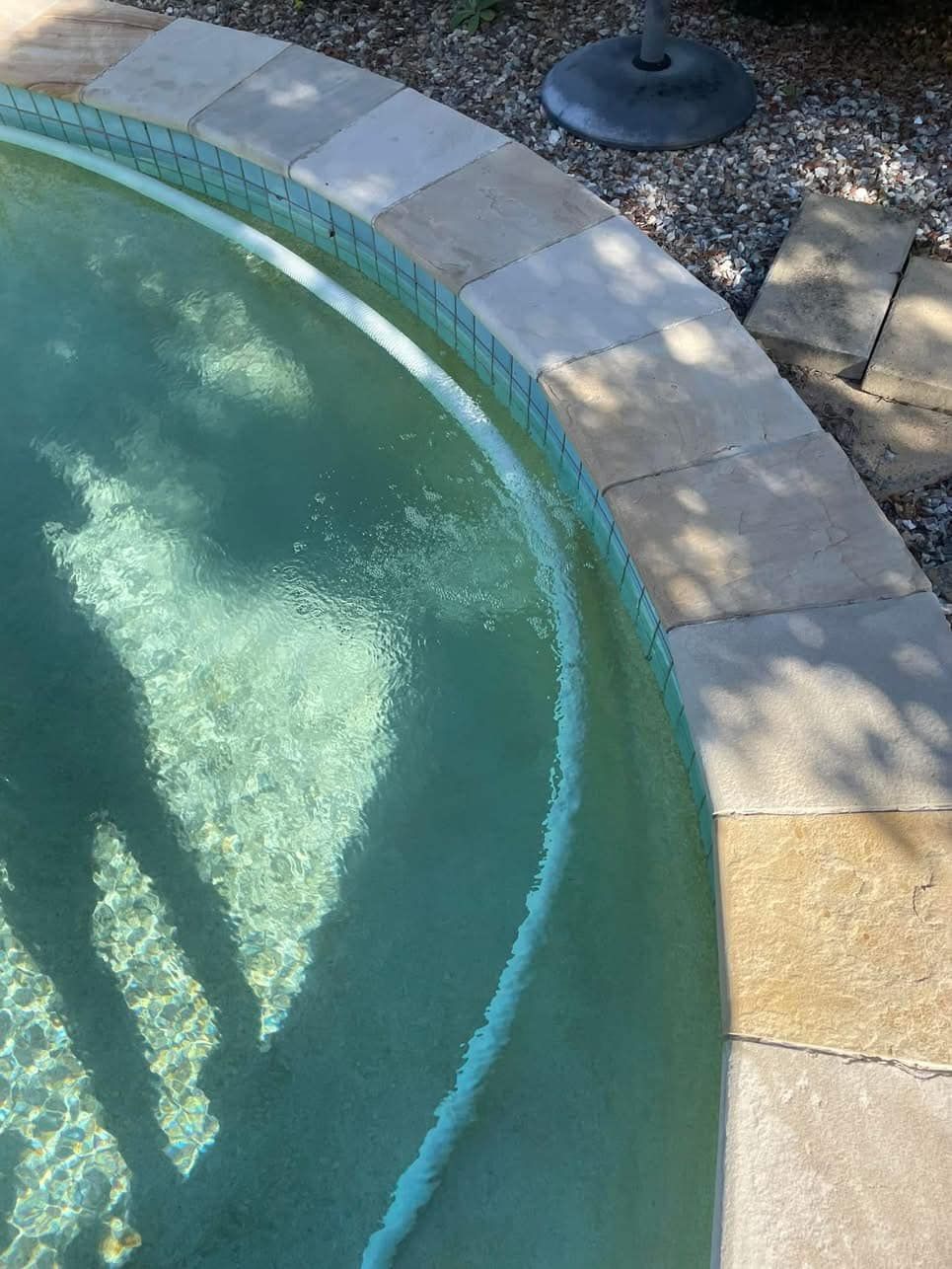 Pool With Light Blue Water and Stone Border — Leak N Pool In Southport, QLD