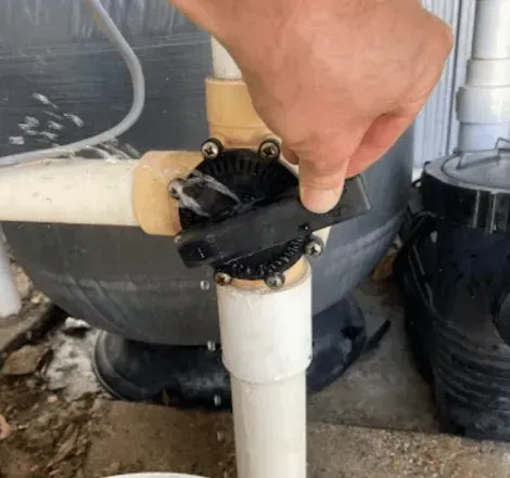 Hand Turning a Pool Filter Valve, Water Leaking — Leak N Pool In Southport, QLD