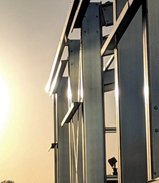 Cold-formed metal building primary frame with columns and rafters highlighted