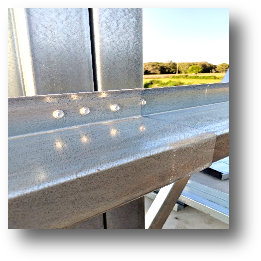 Roof purlins and wall girts on a cold-formed metal building frame