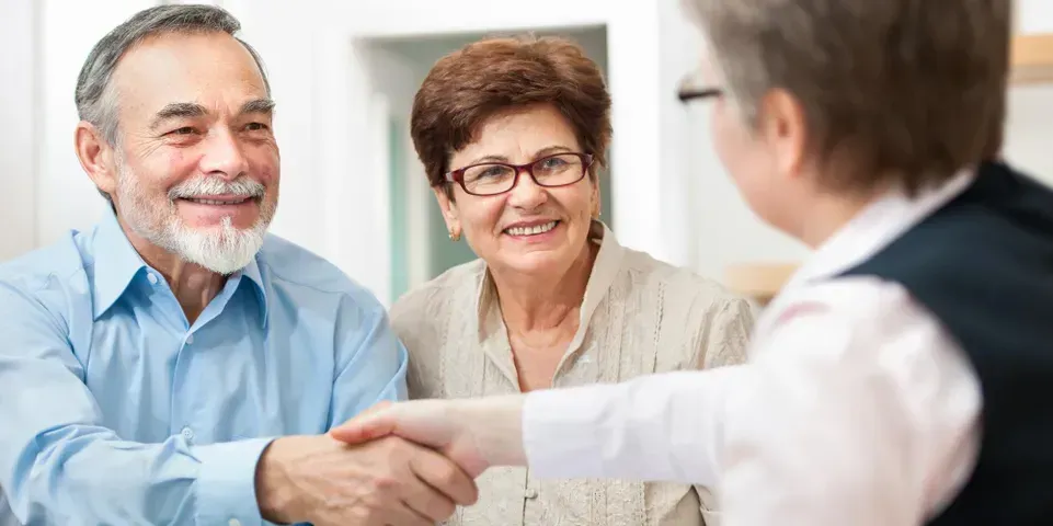 Old couple consulting an attorney