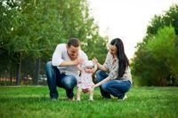 Couple playing with their child